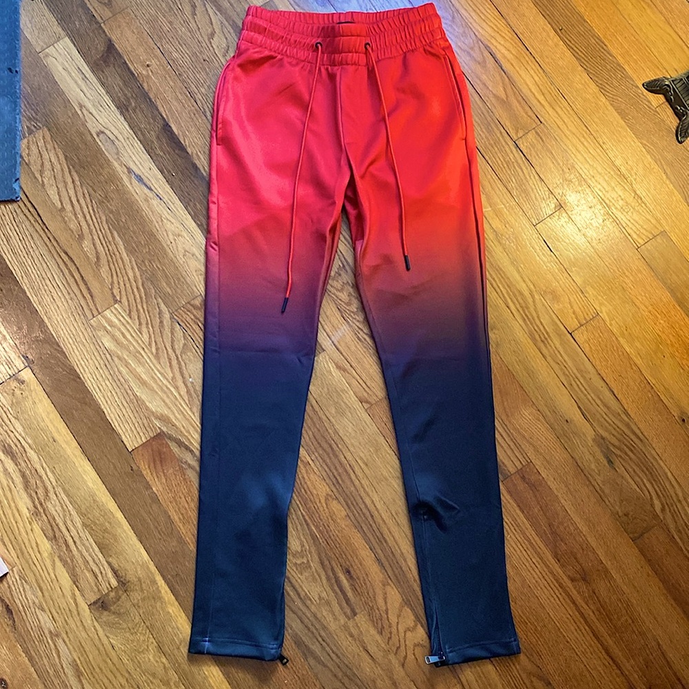 Very soft style gradient red/black style sweatpants with zippers near the ankle.